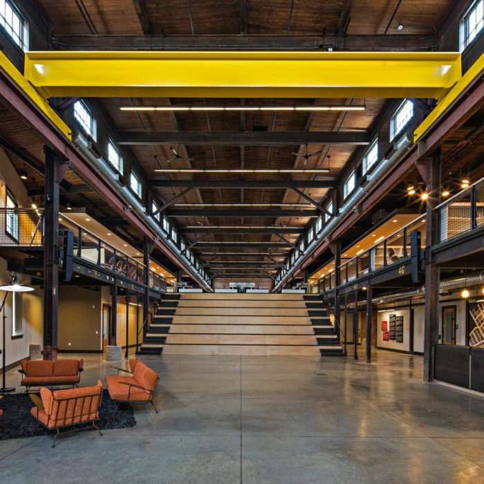 Natural light streaming into the interior highlighting the character of the building in this adaptive reuse project