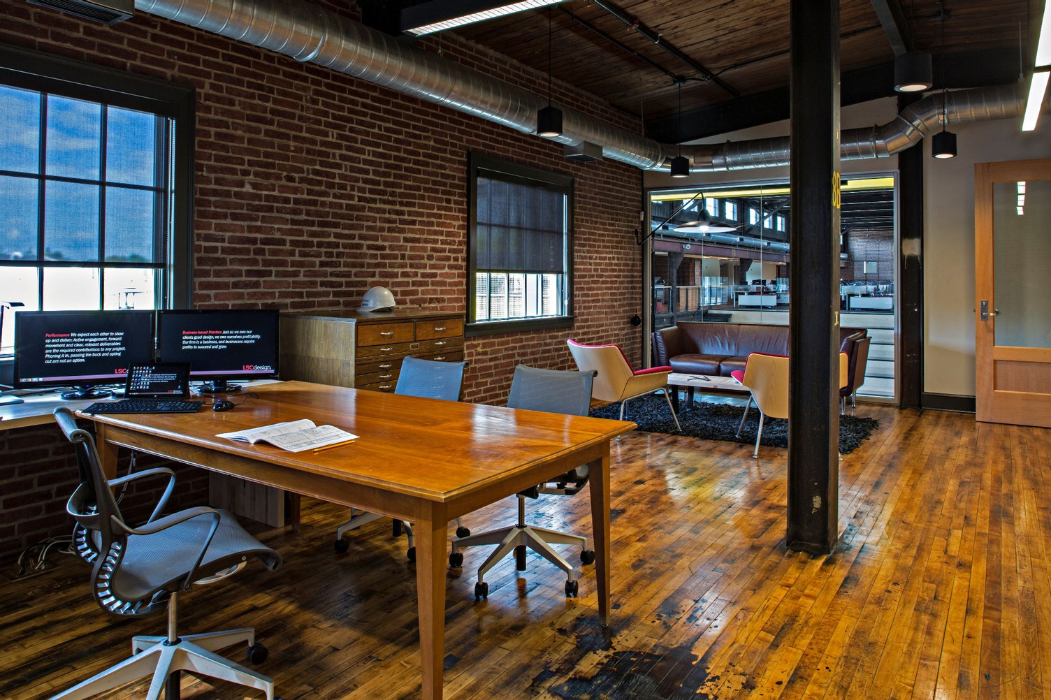 Collaborative work environment with work stations, team spaces and conference rooms with modern and classic styling